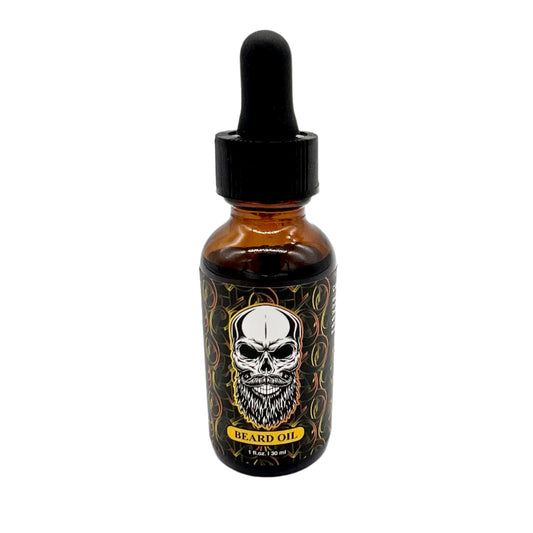 The photo depicts a bottle of El Barber Beard Oil. The bottle is amber with a black dropper cap. The label features a detailed design, including a prominent skull with a full beard. It also states "Beard Oil" and "1 fl oz / 30 ml" in yellow text. The overall design is bold and visually striking, reflecting the brand's edgy style.